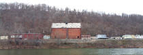 Across river from Brownsville, Thompson Distillery building continues to dominate view.